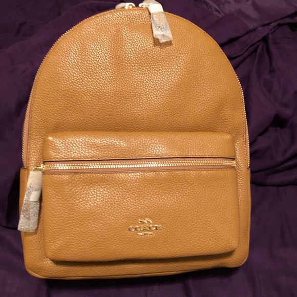 Coach Handbags - Coach backpack leather tan with black straps